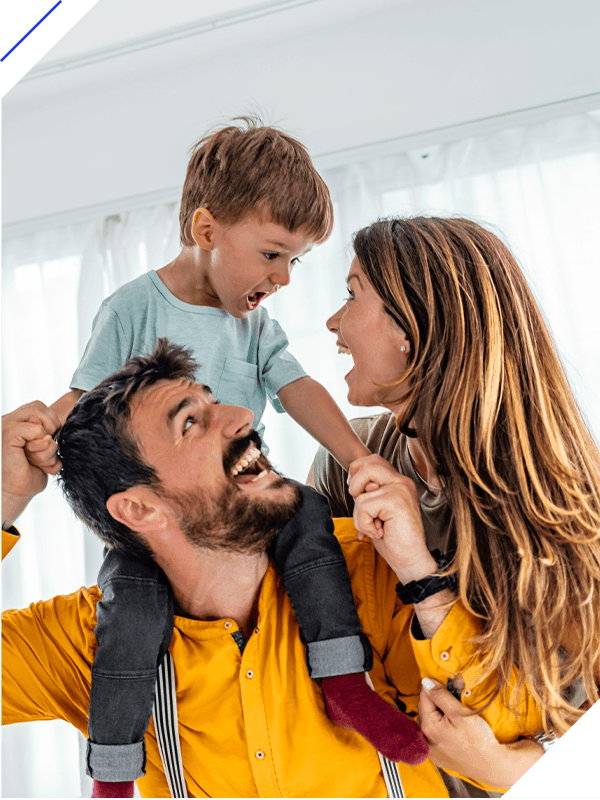 Happy family, mother and father playing with a son at home.
