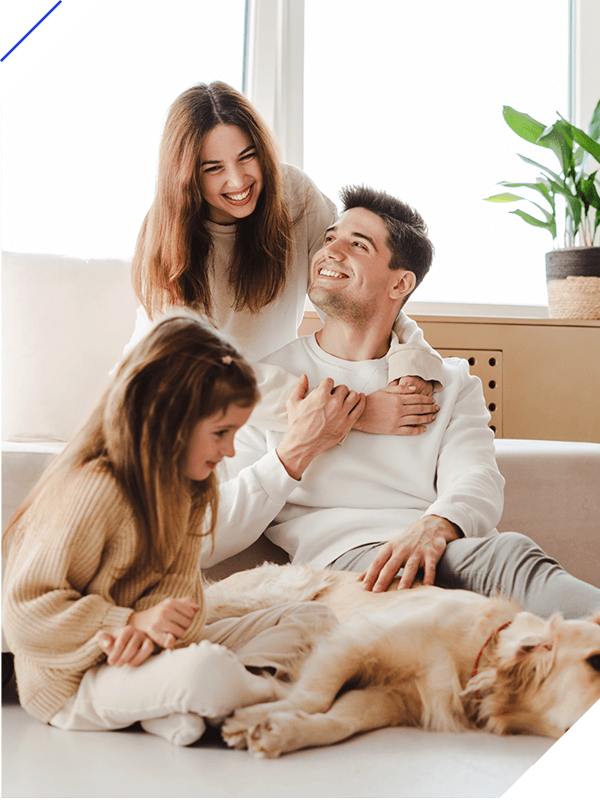 Smiling family relaxing together, woman hugging man