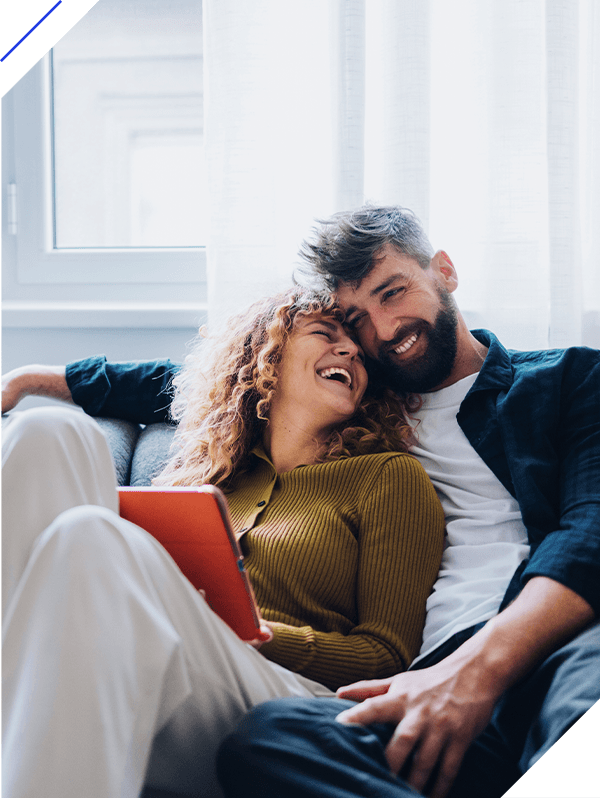 Smiling couple enjoying leisure time together at home