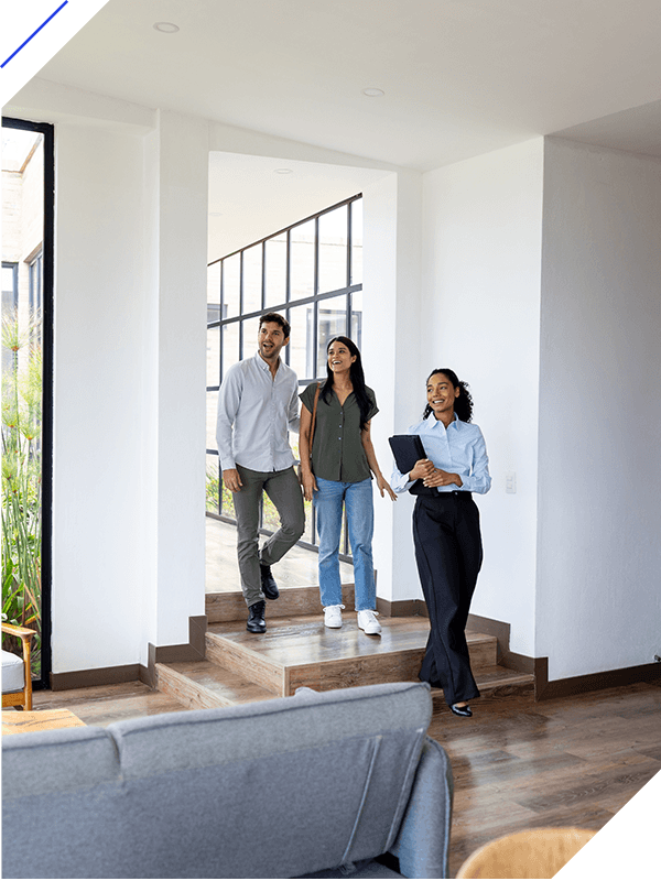 Couple looking at a house for sale with a real estate agent
